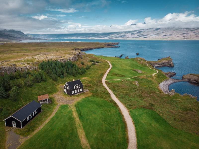 Aerial view of houses and cars on seashore, snaefellsnes, icelan