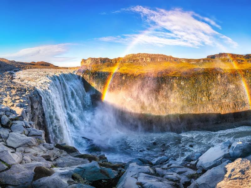 Breathtaking sunrise view of the most powerful waterfall in Europe called Dettifoss with rainbow