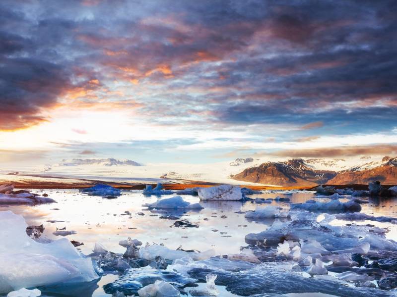 Jokulsarlon glacier lagoon, fantastic sunset on the black beach,
