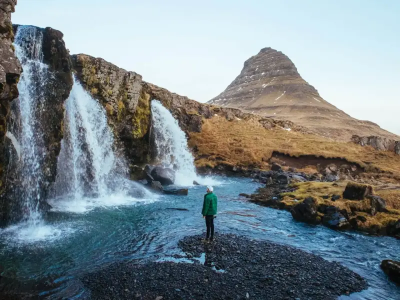 man_standing_at_kirkjufellsfoss_robert_bye_unsplash_42269a7b3e